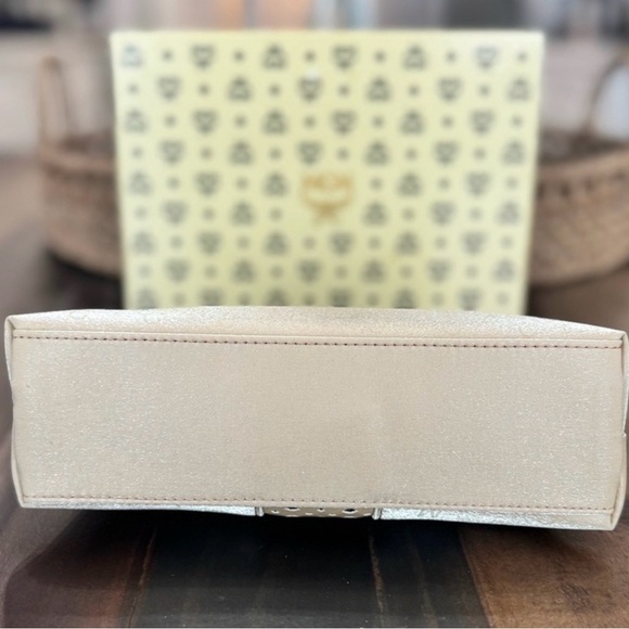 MCM Mini Top Handle Bag
Champagne Monogram Leather - Picture 4 of 15